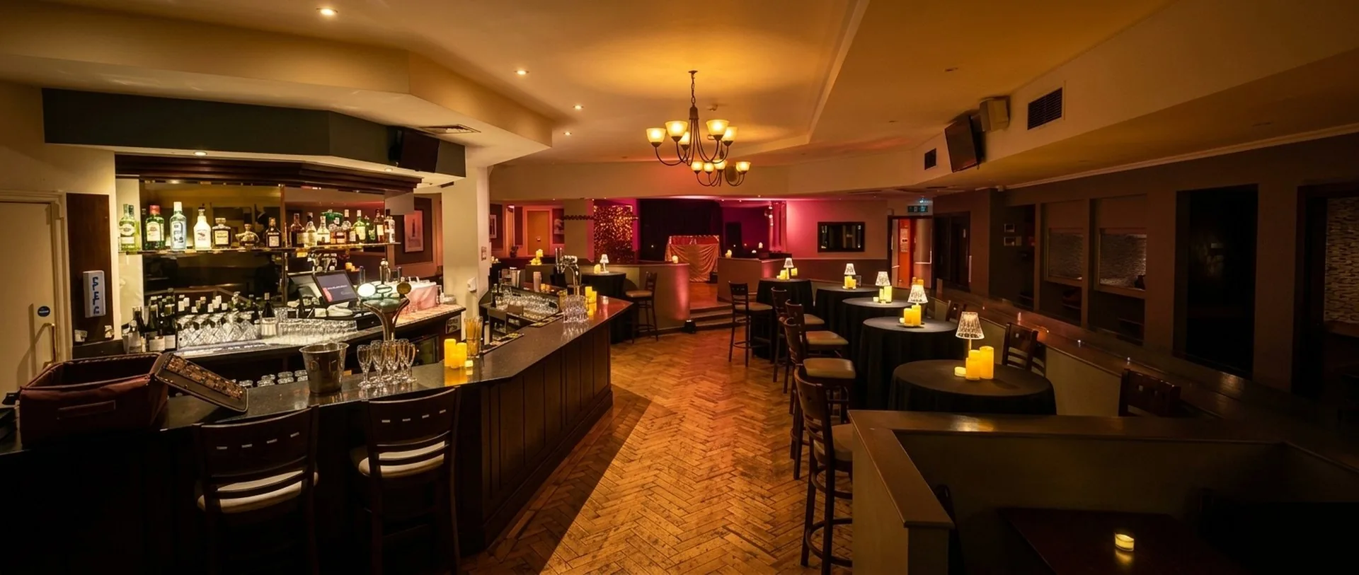The main room at Steam Wine Bar, a warm candlelit basement bar in the City of London